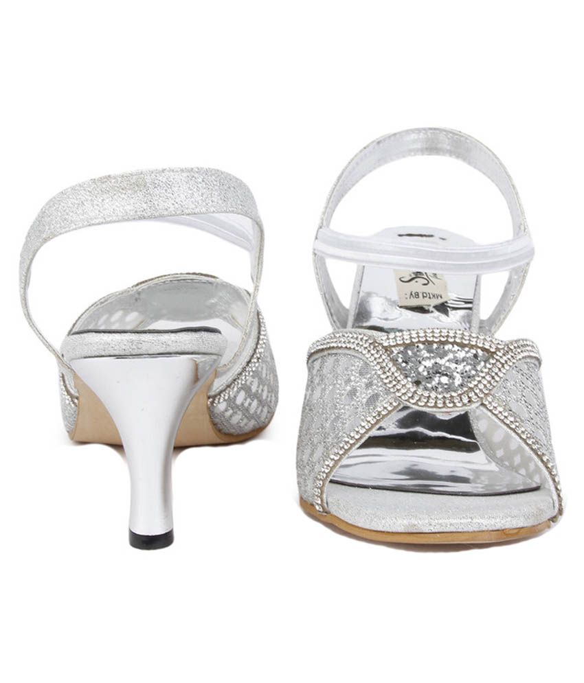 famous footwear silver heels