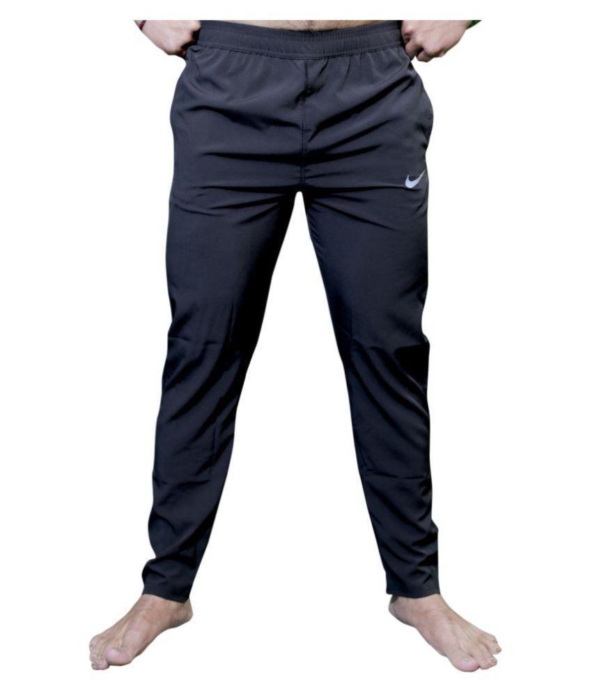 Pants: 90s -Nike- Mens black solid colored polyester flat front, slightly  tapered leg track pants with elastic cuff hem with ankle zipper, inset  pockets at the hips, one rear patch pocket, elastic