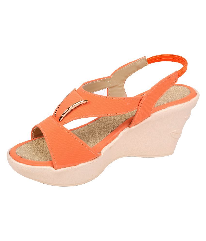 orange platform pumps