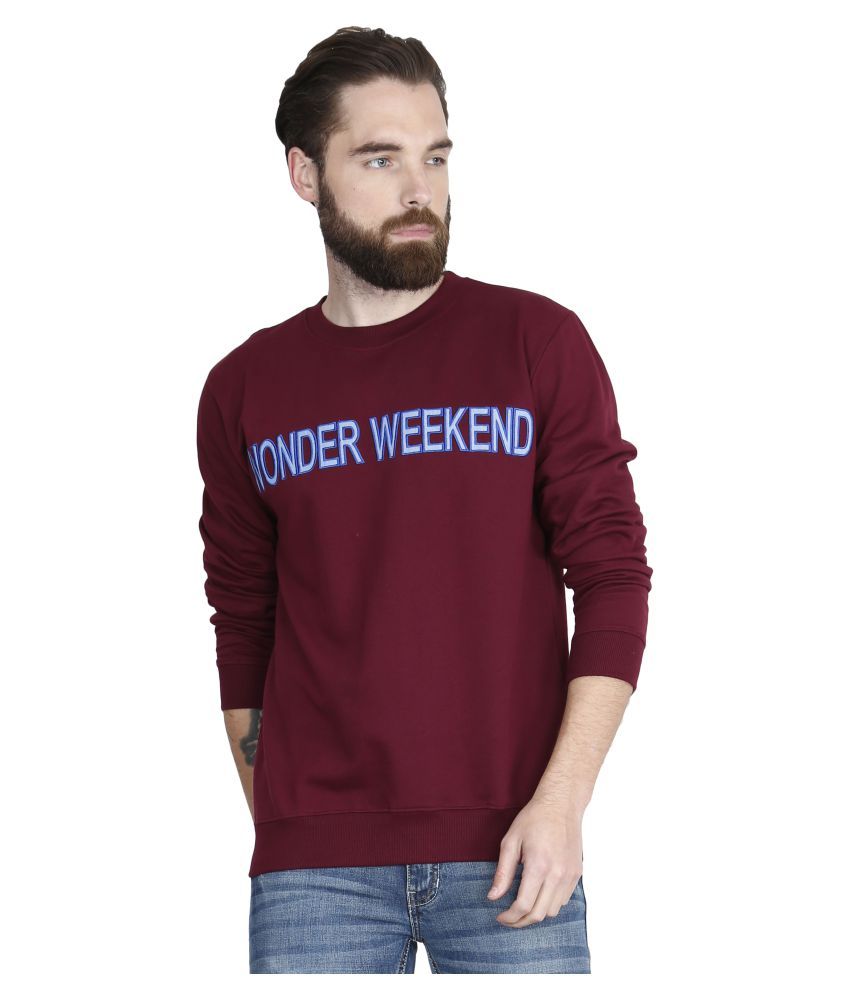 maroon sweater and jeans