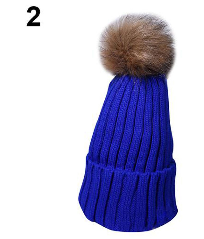 hat with fuzzy ball on top