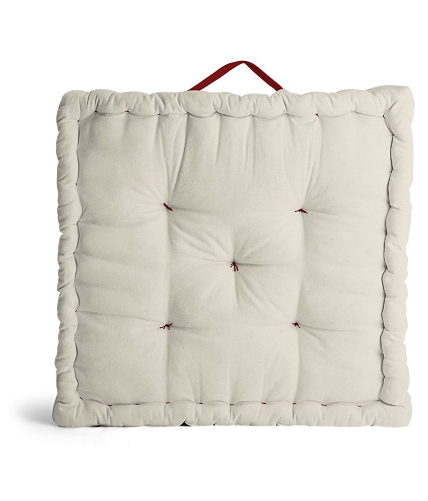 white floor cushion