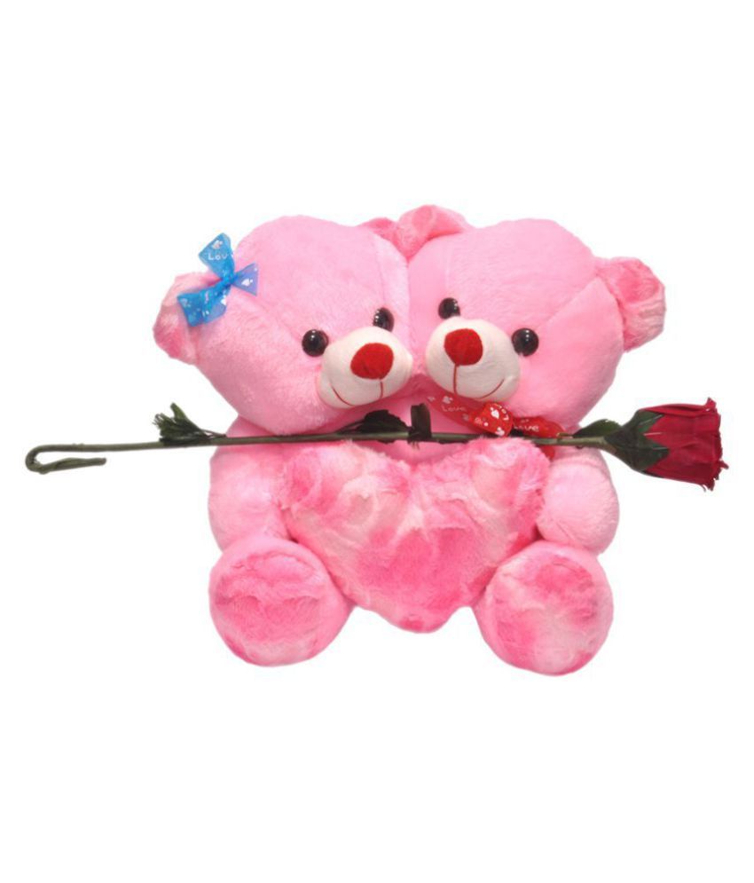 pink teddy bear made of roses