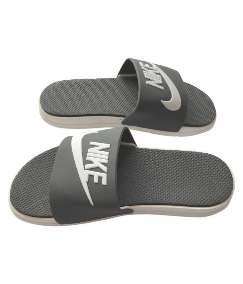 black and grey nike slides