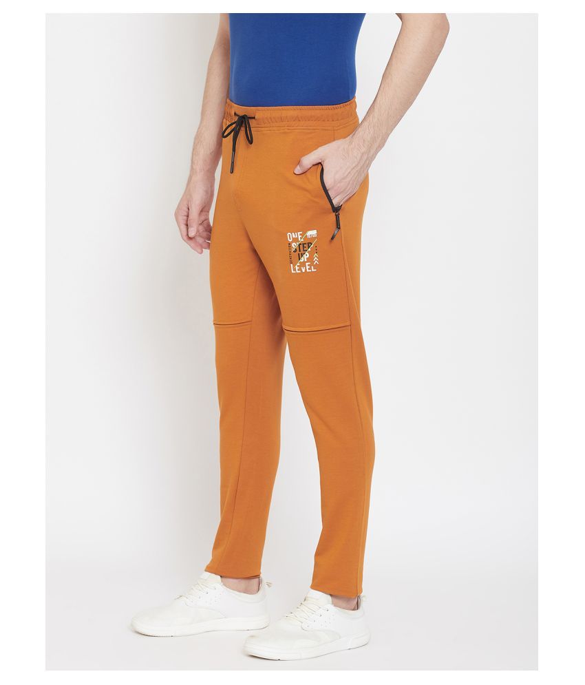 mustard track pants