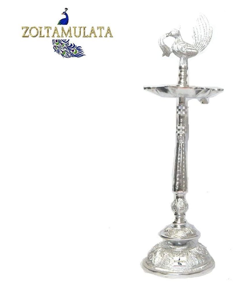 white metal diya