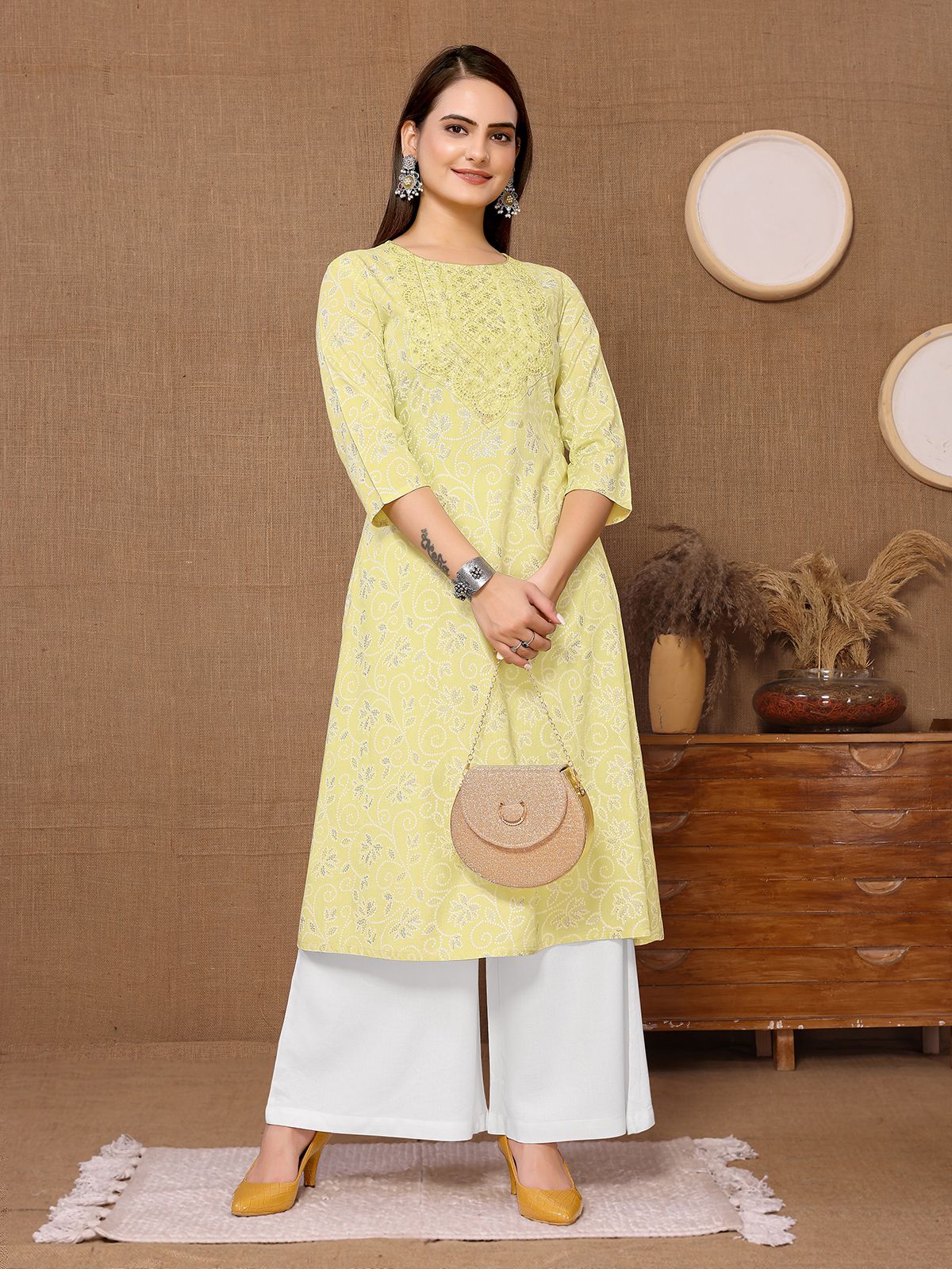     			Rangita Women Rayon Yellow Embroidered Calf Length A-line Kurti