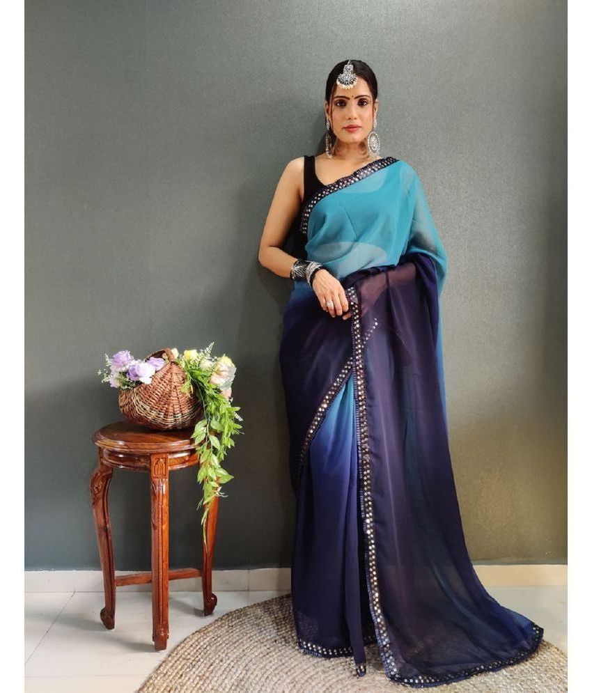     			Apnisha Georgette Dyed Saree With Blouse Piece - Teal ( Pack of 1 )